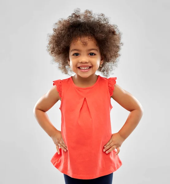 Happy little african american girl over grey — Stock Photo, Image