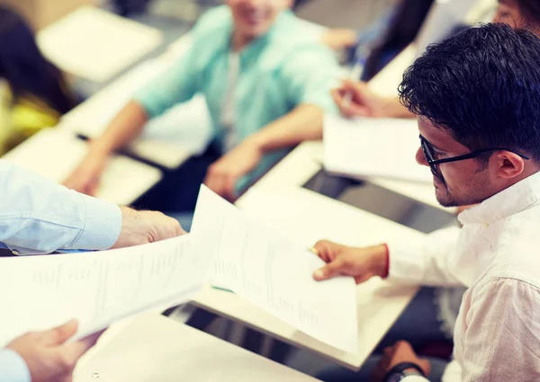 Teacher giving exam test to student man at lecture — Stock Photo, Image