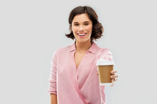 Woman drinking takeaway coffee in paper cup — Stok fotoğraf
