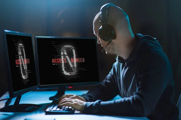 Hacker with access denied messages on computers — Stock Photo, Image