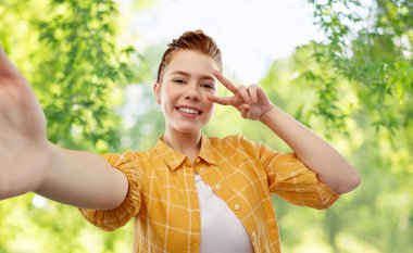 redhead teenage girl taking selfie making peace clipart