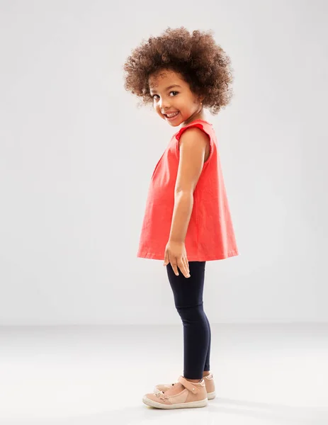 Happy little african american girl over grey — Stock Photo, Image