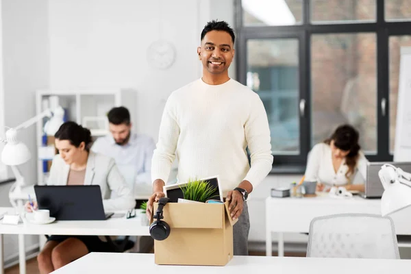 Happy male office worker with personal stuff — Stock Photo, Image