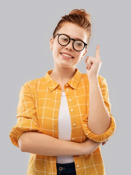 Smiling red haired teenage student girl in glasses — Stock Photo, Image