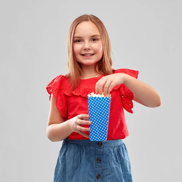 Beautiful smiling girl in red shirt and skirt — Stock Photo, Image