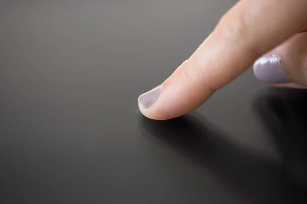 Hand using black interactive panel — Stock Photo, Image