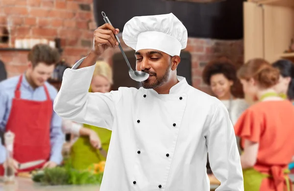 Chef tasting food from ladle at cooking class — Stock Photo, Image