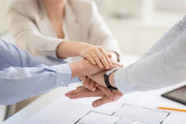 Close up of business team stacking hands — Stock Photo, Image