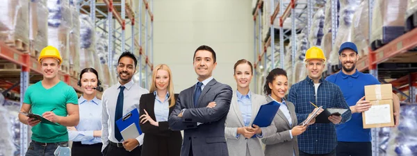 Group of business people and warehouse workers — Stock Photo, Image
