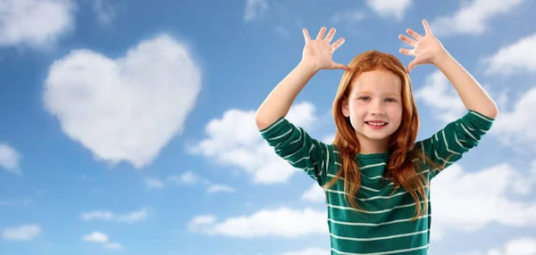 Red haired girl having fun and making big ears — Stock Photo, Image