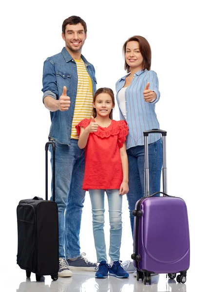 Familia feliz con bolsas de viaje mostrando los pulgares hacia arriba —  Fotos de Stock