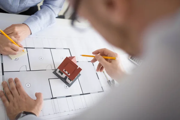 Close up of architects discussing house project — Stock Photo, Image