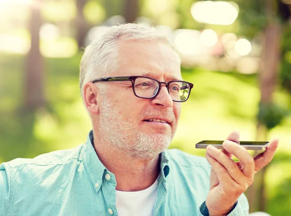 Old man using voice command recorder on smartphone — Stock Photo, Image