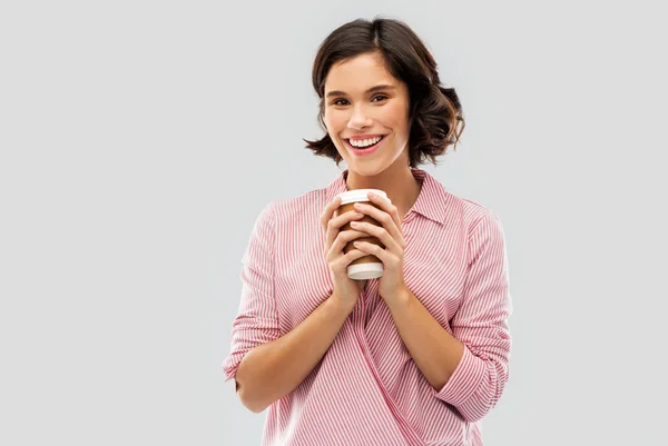 Woman drinking takeaway coffee in paper cup — Stock Photo, Image