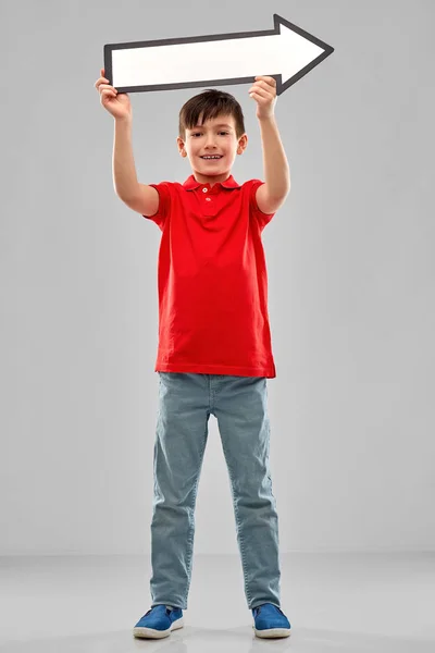 Jongen Holding grote witte bewegen dikke pijl — Stockfoto