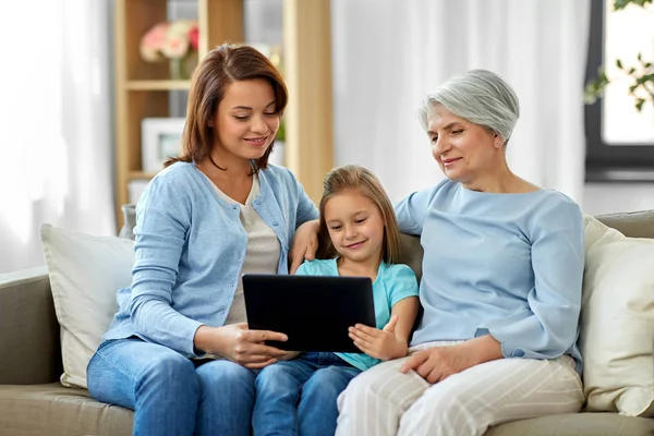 Mother, daughter and grandmother with tablet pc — Stock Photo, Image