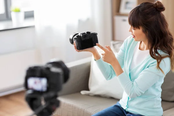 Asian female blogger with camera recording video — Stock Photo, Image