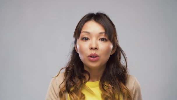 Asian woman making shush gesture — Stock Video