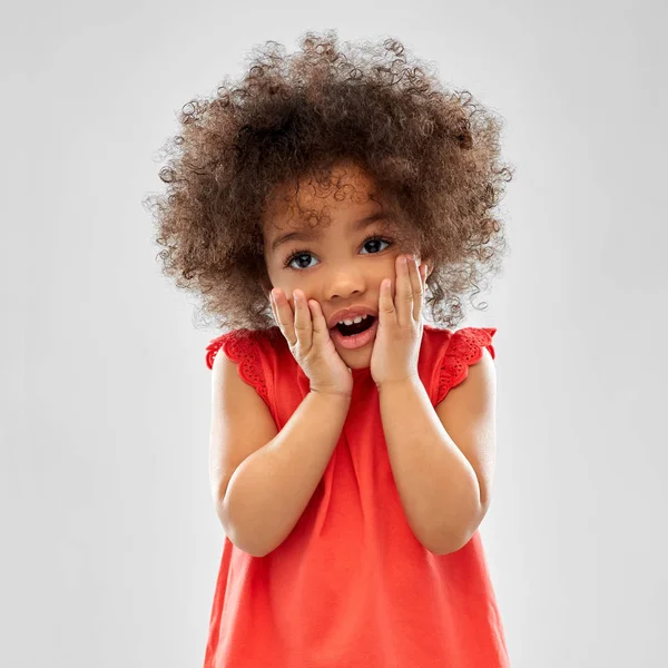 Surprised or scared little african american girl — Stock Photo, Image