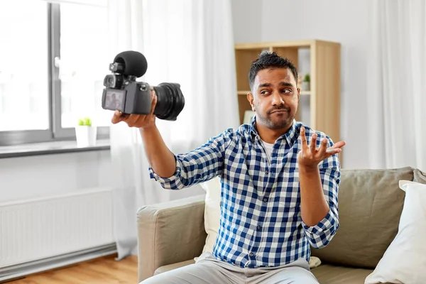 Male video blogger with camera blogging at home — Stock Photo, Image