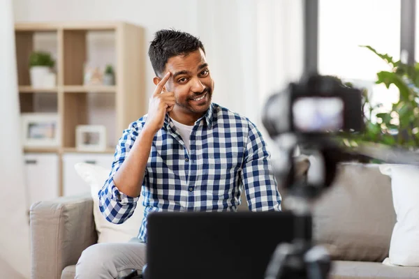 Male blogger with camera videoblogging at home — Stock Photo, Image
