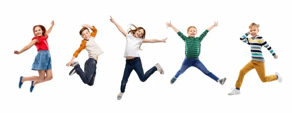 Happy children jumping over white background Stock Picture