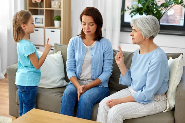Daughter, mother and grandmother arguing at home — Stock Photo, Image