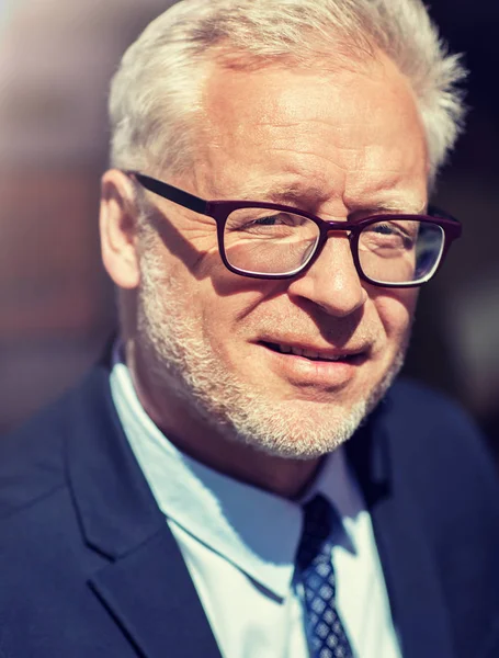 Close up of senior businessman in eyeglasses — Stock Photo, Image