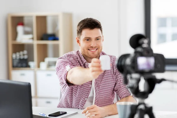 Male blogger with camera videoblogging at home — Stock Photo, Image