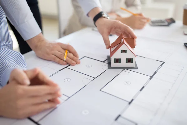 Close up of architects discussing house project — Stock Photo, Image