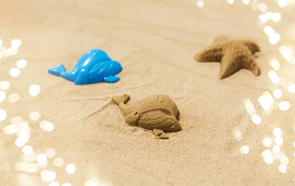 Sand shape made by whale mold on summer beach — Stock Photo, Image