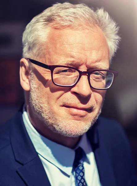 Close up of senior businessman in eyeglasses — Stock Photo, Image