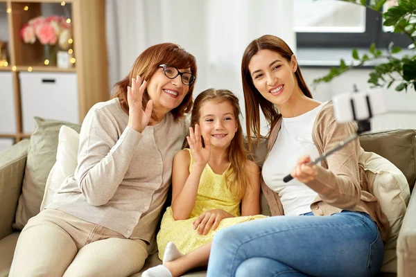 Mother, daughter and grandmother taking selfie — Stock Photo, Image