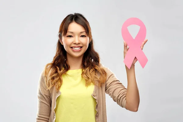 Asian woman with breast cancer awareness ribbon — Stock Photo, Image