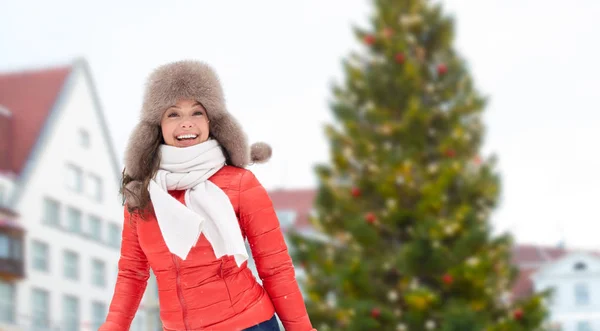 Happy woman over christmas tree in tallinn — Stock Photo, Image