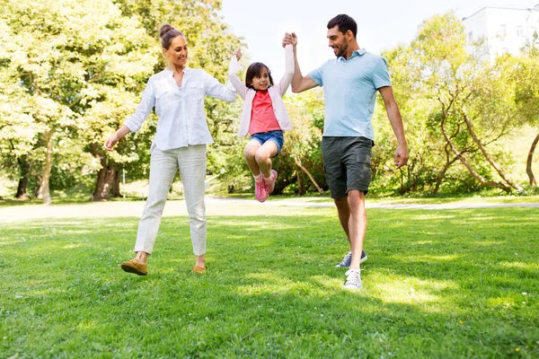 Happy family walking in summer park Stock Picture