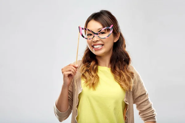 Happy asian woman with big party glasses — Stock Photo, Image