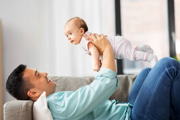 Happy middle aged father with baby at home — Stock Photo, Image
