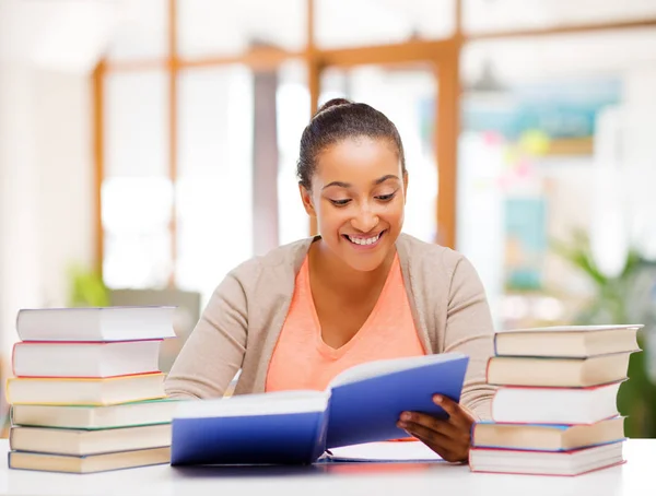 African american female student reading book — Stock Photo, Image