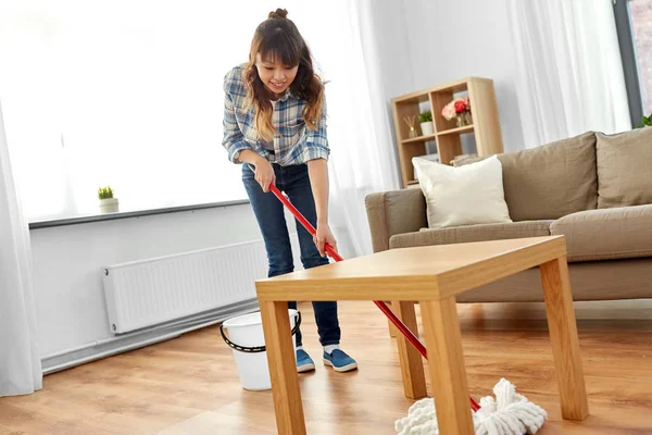 Woman or housewife with mop cleaning floor at home — Stock Photo, Image