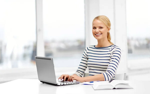 Student woman with laptop and book — Stock Photo, Image