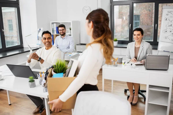 Happy businesswoman with personal stuff at office — Stock Photo, Image