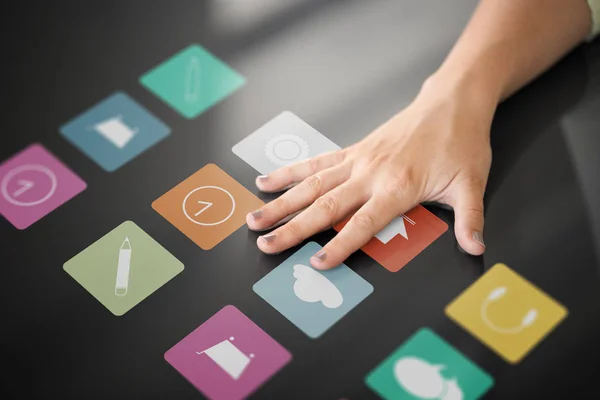 Hand using interactive panel with app icons on it — Stock Photo, Image