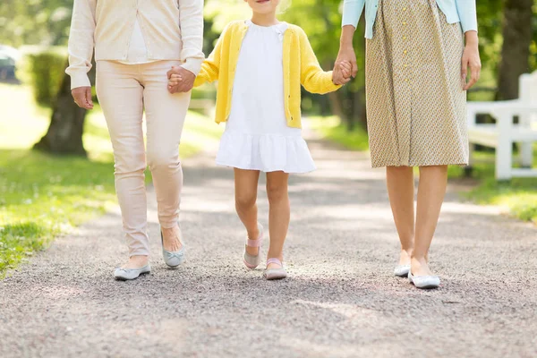 Mother, daughter and grandmother walking at park — Stock Photo, Image