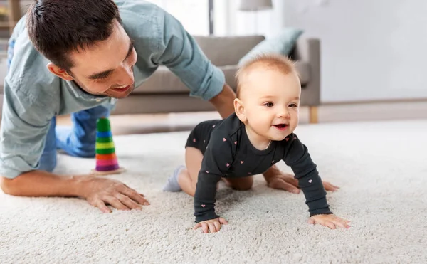 Happy little baby girl with father at home — Stock Photo, Image