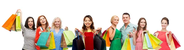 Asian woman with shopping bags and people — Stock Photo, Image