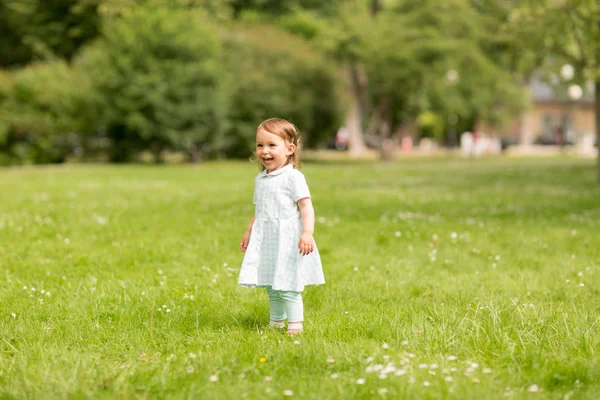 Happy little baby girl at park in summer — Stock Photo, Image