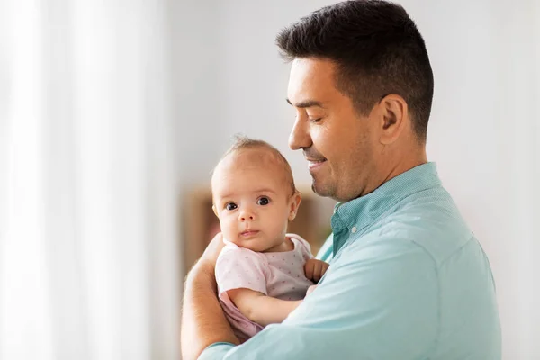 Middle aged father with baby daughter at home — Stock Photo, Image