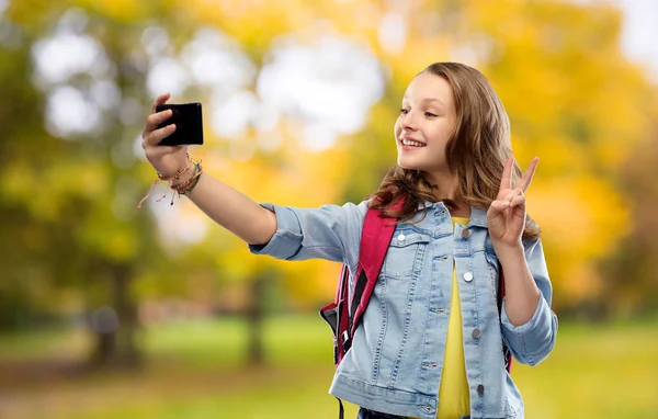 Teenage student girl taking selfie by smartphone Royalty Free Stock Images