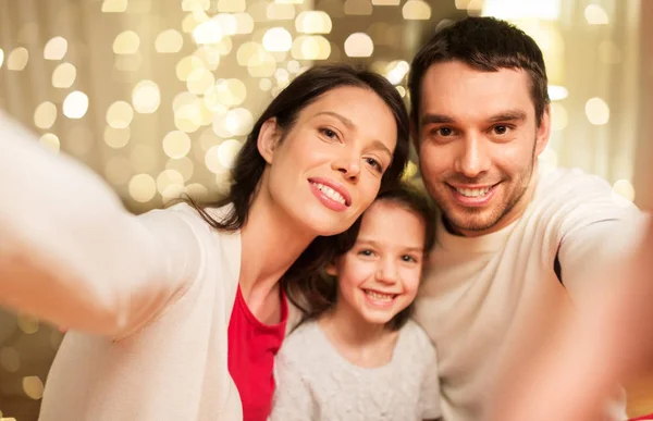 Happy family taking selfie at christmas Royalty Free Stock Photos